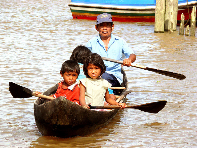 Warao indians in a canoe at San Francisco de Guayo in Venezuela