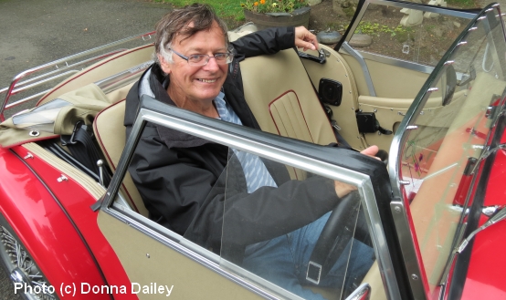 Travel writer Mike Gerrard at the wheel of a Morgan 4/4 sports car available for hire to drive in Scotland.