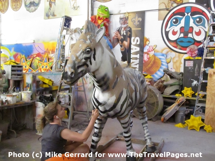 Mn painting a zebra in Mardi Gras World, New Orleans, Loisiana.