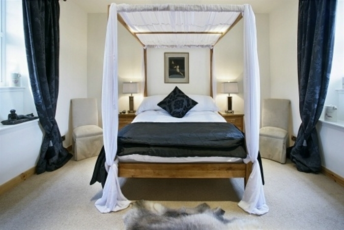 The Bell Tower Bedroom at Mains of Taymouth luxury holiday cottages in Kenmore in Scotland.