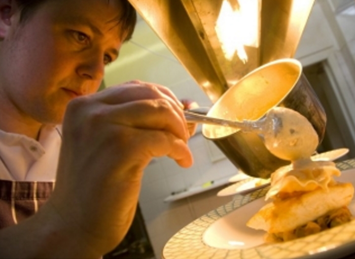 A chef prepares a dish from the menu of the most romantic restaurant in Scotland, the luxury Ardanaiseig country House hotel.